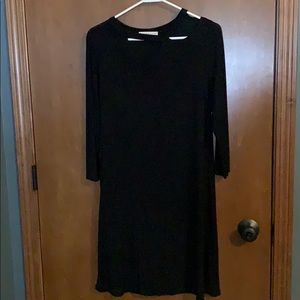 3/4 sleeve black dress with neckline detail